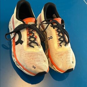 On Running White and Orange Sneakers